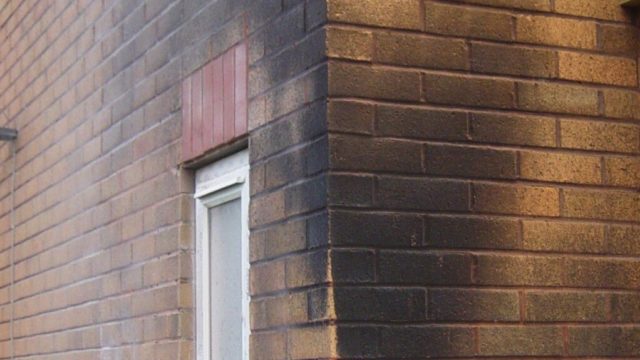 Soot and smoke damage to external home brick wall