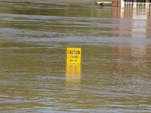 flooding with caution sign